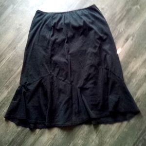 Sheer black mini skirt w polka dot detail and sheer lining.
